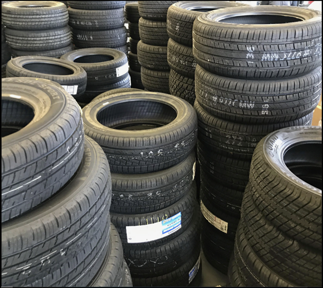 A picture of new tires in stacks.